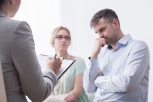 Husband and Wife consulting a lawyer