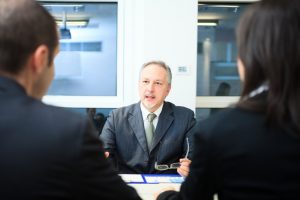 a divorce lawyer talking to a couple