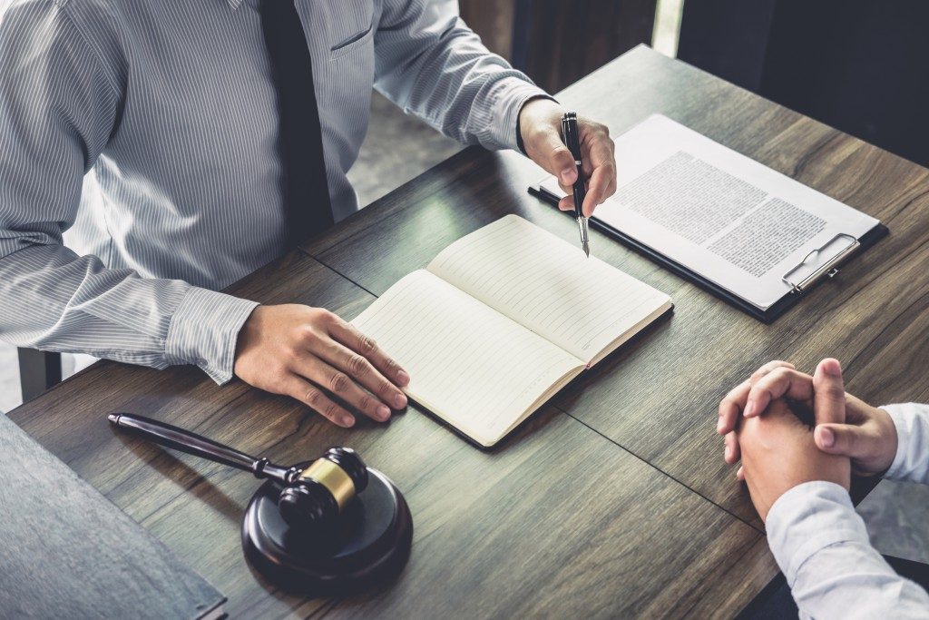 a lawyer talking to a client