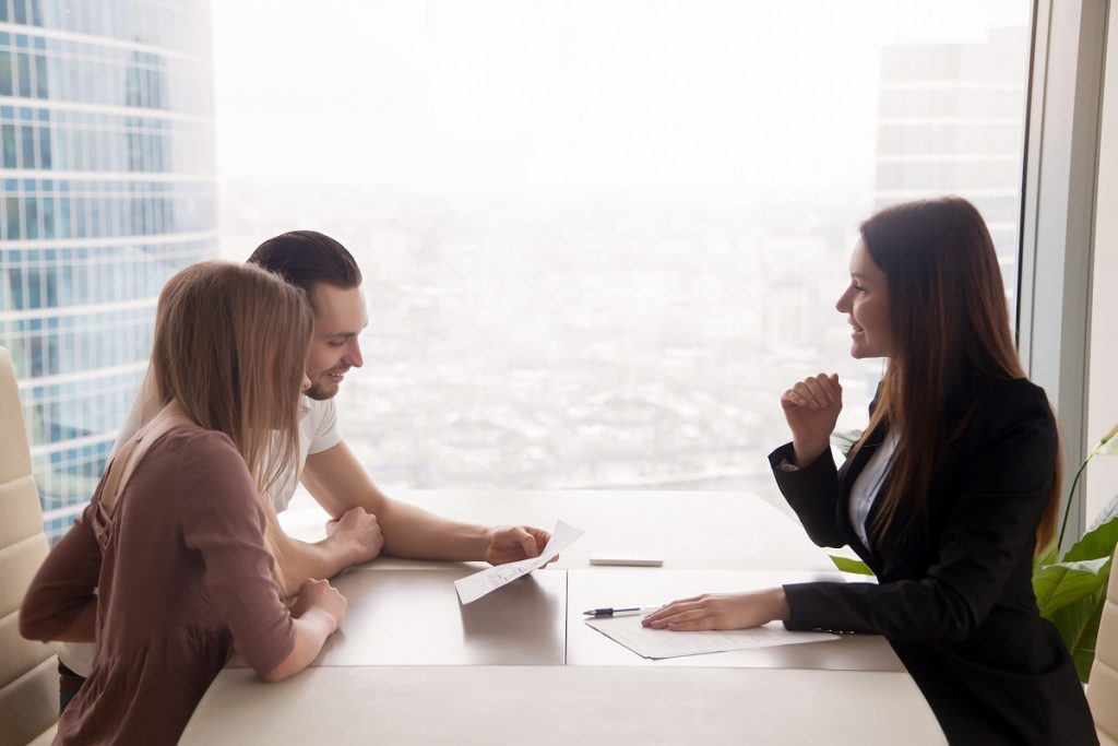 Couple with real estate agent